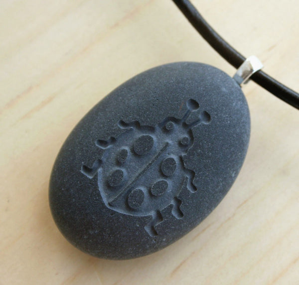 Ladybug pendant with cord - Tiny PebbleGlyph (C) - Engraved beach stone necklace